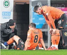  ??  ?? Peter Pawlett receives treatment in the Partick clash.