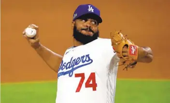  ?? RONALD MARTINEZ GETTY IMAGES ?? Dodgers’ Kenley Jansen was pulled after giving up two runs in the ninth inning of Game 2 against the Padres.