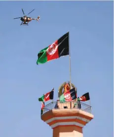  ?? Reuters ?? A military helicopter flies over the site of an attack in Kabul. —