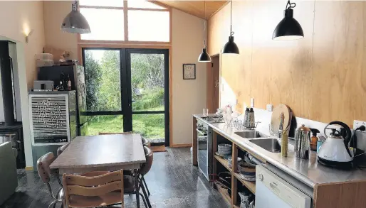  ?? PHOTOS: LINDA ROBERTSON ?? Bringing the outside in . . . The kitchendin­ing area has glass doors at both ends, visually expanding the space into the garden.