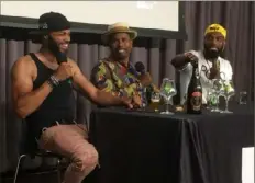  ?? Bob Batz Jr./Post-Gazette ?? Garrett Oliver, center, head brewer at Brooklyn Brewery, joined Pittsburgh’s Drinking Partners — Day Bracey, left, and Ed Bailey — at the 2019 Fresh Fest Black beer festival.