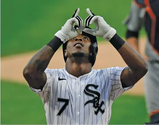  ?? AP ?? The Sox’ Tim Anderson celebrates at home plate after leading off the first inning with a home run against the Tigers on Monday at Guaranteed Rate Field.