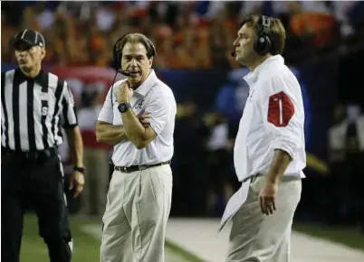 ??  ?? Alabama head coach Nick Saban, left, will match wits with former assistant Kirby Smart with the national championsh­ip on the line Monday night. Left: Sean M. Haffey / Getty Images Top: David Goldman / Associated Press