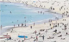  ?? ?? LIFE’S A BEACH: Sunseekers flock to Bondi despite the risk of a further spread of Covid-19 in Sydney.