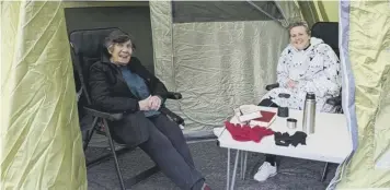  ?? ?? ALL SMILES: Cherry and Rev Michelle in the tent