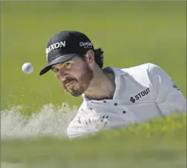  ?? Gregory Bull Associated Press ?? SAM RYDER HITS out of a bunker on the eighth hole of the South Course at Torrey Pines during the second round of the Farmers Insurance Open.