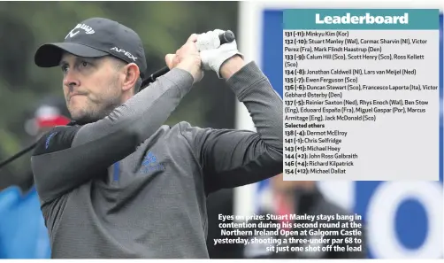  ??  ?? Eyes on prize: Stuart Manley stays bang in contention during his second round at the Northern Ireland Open at Galgorm Castle yesterday, shooting a three-under par 68 tosit just one shot off the lead