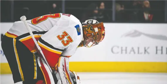 ?? GETTY IMAGES/FILES ?? Goalie David Rittich takes a break during a game against the Golden Knights last February in Las Vegas. In four trips to Nevada, the Flames have yet to notch a win.