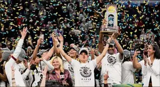  ?? Eric Gay / Associated Press ?? South Carolina head coach Dawn Staley, center, who won the NCAA Tournament this year, is one of a shrinking number of women who coach women’s teams.