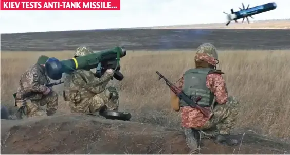  ?? ?? Getting ready: Ukrainian soldiers fire an anti-tank missile in a military exercise this week as the country prepares for a possible invasion