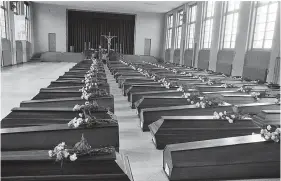  ?? (Mirrorpix) ?? Coffins laid out in a local hall at Dornach
