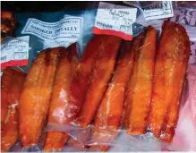  ??  ?? BELOW Smoked fish for sale in a high-end delicatess­en, vacuum-packed and labelled.