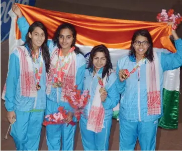  ?? — PTI ?? ( Left) Members of the 4x100m medley women’s team pose after claiming the top position ahead of Pakistan and Bangladesh in Guwahati on Wednesday.