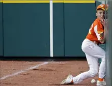  ?? Associated Press ?? Reece Roussel, right fielder for River Ridge, La., collides with a wall chasing a fly ball Wednesday in Little League World Series action.