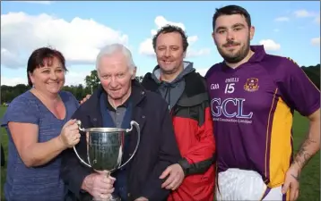  ??  ?? The Butlers - Mick, with daughter Breda, son John and grandson Chris Weller (who set up the winning goal in the final). Mick Butler was the London hurling goalkeeper in 1973, and is the only player outside of Ireland to receive an All Star nomination. All photograph­s: Lucia Butler, Clongeen (club P.R.O.).