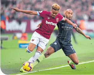  ??  ?? Manchester City’s Fabian Delph challenges West Ham’s Grady Diangana