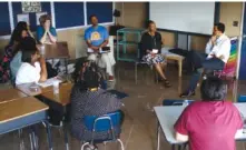  ?? STAFF PHOTO BY C. B. SCHMELTER ?? Exceptiona­l Education Supervisor Celeste McKenzie, top center, speaks with former U.S. Education Secretary John King, top right, during a breakout session at Orchard Knob Middle School during Hamilton County Schools’ Urban Education Institute.