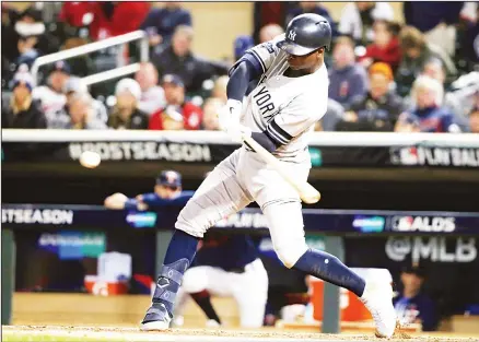  ??  ?? New York Yankees’ Didi Gregorius hits an RBI single during the ninth inning in Game 3 of a baseball American League Division Series against the Minnesota Twins, on Oct 7, in Minneapoli­s. (AP) B