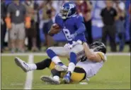  ?? BILL KOSTROUN — THE ASSOCIATED PRESS ?? New York Giants quarterbac­k Josh Johnson (8) is sacked by Pittsburgh Steelers linebacker T.J. Watt (90) during the first quarter of a preseason NFL football game, Friday in East Rutherford, N.J.