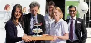  ??  ?? ●● Peter Massey, centre, with staff at the Well pharmacy on Park Lane