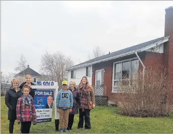  ?? SUBMITTED ?? From the left: Karen Chapman, program manager, Roxanne MacLean-Swinamer, mentoring co-ordinator, with Little Sister Marlee on the right of the sign: Little Brother Deven, executive director Margie Grant-Walsh, project co-ordinator Mary Frances Galvin.