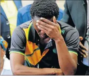  ??  ?? COFFIN VICTIM: Victor Rethabile Mlotshwa reacts after the appearance in the Middelburg Magistrate’s Court of two men who allegedly pushed him into a coffin and threatened him