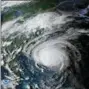  ?? NOAA VIA AP ?? This enhanced satellite image made available by NOAA shows Hurricane Florence off the eastern coast of the United States on Wednesday, Sept. 12, at 5:52 p.m. EDT.