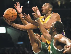  ?? Branimir Kvartuc / Associated Press ?? In this Feb. 23, 2007, file photo, Los Angeles Lakers’ Kobe Bryant, top, goes up for a shot between Boston Celtics’ Paul Pierce, left, and Al Jefferson during the first half in Los Angeles. Bryant was one of eight finalists announced Friday as candidates for enshrineme­nt into the Basketball Hall of Fame later this year, a decision that came as absolutely no surprise in his first year of eligibilit­y.