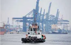  ??  ?? A tug boat is seen near a container port in Tanjung Priok, North Jakarta, Indonesia.