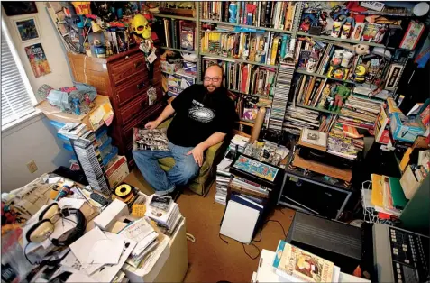  ?? Arkansas Democrat-Gazette/JOHN SYKES JR. ?? Harold Ott, founder of Psych of the South, listens to records in his childhood bedroom, where he also stores nonmusical collection­s. He jokes about being a hoarder, but he says, “I couldn’t do this without hoarders.”