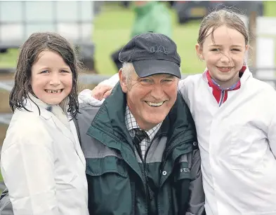  ??  ?? Ruby and Gemma Stewart, from Hatton of Newtyle, looking smartly dressed with the help of their grandad, David Soutar, for the junior sheep handling.