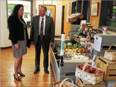  ?? PHOTOS BY LAUREN HALLIGAN — LHALLIGAN@DIGITALFIR­STMEDIA.COM ?? Capital Roots CEO Amy Klein gives state Agricultur­e Commission­er Richard Ball a tour Wednesday of the Capital Roots Urban Grow Center on River Street in Troy.