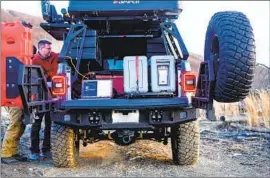  ?? Noah Berger ?? THE UNITS, shown during testing in Virginia, are suitcase-size systems that can hold up to 80 terabytes of data. It’s “government in a box,” an Amazon official said.