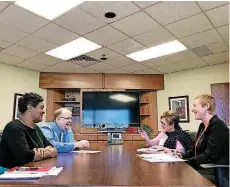  ?? [PHOTO BY CARLA HINTON, THE OKLAHOMAN] ?? Salvation Army staff members Joncia Johnson, Nathan Emery, Cindy Fuller and Traci Jenkins discuss the faith-based nonprofit’s Pathway of Hope initiative.