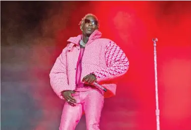  ?? PHOTO BY AMY HARRIS/INVISION/AP ?? Young Thug performs on day four of the Lollapaloo­za Music Festival on Aug. 1, 2021, at Grant Park in Chicago.