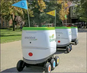  ?? Courtesy of PepsiCo via AP ?? These self-driving robots made by Robby Technologi­es started making snack deliveries recently at the University of the Pacific in Stockton, Calif.