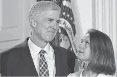 ?? ALEX WONG, GETTY IMAGES ?? Neil Gorsuch, with his wife, Louise, could, at 49, represent a generation­al change at the Supreme Court.