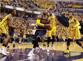  ?? — AP ?? Cleveland Cavaliers’ LeBron James goes to the basket against Indiana Pacers.