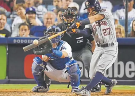  ?? Mark J. Terrill, Associated Press file ?? The Houston Astros’ Jose Altuve hits a home run against the Los Angeles Dodgers during Game 2 of last year’s World Series. The Astros enter this season as defending world champions for the first time.