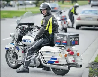  ?? WAYNE LEIDENFROS­T — PNG ?? The Vancouver police trafficser­vices division launched the highrisk driving campaign in Vancouver Wednesday. The police are watching out for distracted drivers.