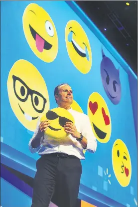  ?? NWA Democrat-Gazette/MICHAEL WOODS • @NWAMICHAEL­W ?? Steve Bratspies, Wal-Mart’s chief merchandis­ing officer, shows off some of the emoji pillows Wednesday during the Wal-Mart U.S. associates’ meeting at the University of Arkansas’ Bud Walton Arena in Fayettevil­le.