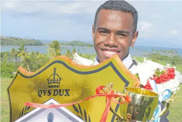  ?? Photo: Ronald Kumar ?? Queen Victoria School 2018 dux Joji Lesi with his prizes after their annual prizegivin­g ceremony at the School on October 12, 2018.