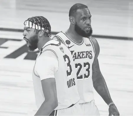  ?? KEVIN C. COX/ GETTY IMAGES ?? LeBron James says even though he gets on teammate Anthony Davis’ nerves ‘ a lot, for sure,’ the Lakers’ superstar says, ‘ we’re not jealous of each other.’