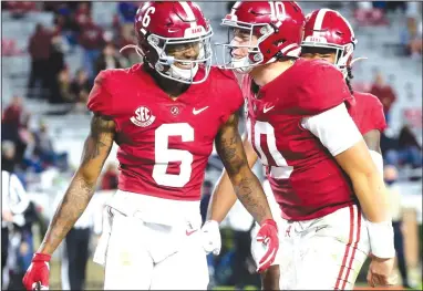  ?? (AP file photo) ?? Heisman Trophy finalists DeVonta Smith (left) and Mac Jones will lead top-ranked Alabama today against No. 4 Notre Dame in the Rose Bowl in Arlington, Texas. Covid-19 restrictio­ns necessitat­ed the game’s move from the traditiona­l site in Pasadena, Calif.