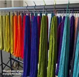  ??  ?? Vibrant hanks of yarn drying in the studio