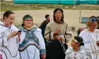  ?? ANDRÉ GALLANT/ADVENTURE CANADA ?? Inuit dancers and singers gather outside the Pond Inlet Community Hall after giving a cultural presentati­on.