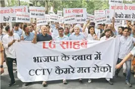  ?? PIC/NAVEEN SHARMA ?? Delhi Chief minister Arvind Kejriwal, deputy CM Manish Sisodia and AAP MLAS march towards the LG’S house on CCTV issue in New Delhi on Monday