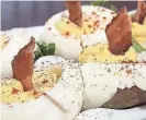  ?? RICHARD LANE/SPECIAL TO THE REGISTER ?? The deviled eggs at Bubba are topped with bacon.