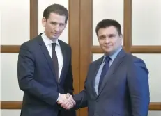  ?? — AFP ?? Ukraine’s Minister of Foreign Affairs Pavlo Klimkine (right) shakes hands with Chairperso­n-in-Office of the OSCE, Federal Minister for Europe, Integratio­n and Foreign Affairs of Austria Sebastian Kurz prior to their meeting in Kiev on Tuesday.