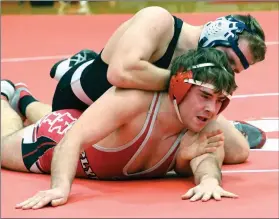  ?? PILOT PHOTO/MAGGIE NIXON ?? Plymouth senior Sam Driver appears to be in trouble but moments later picked up a senior night pin for the Rockies.